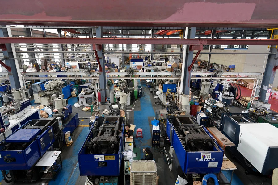 Wide view across the injection molding production floor