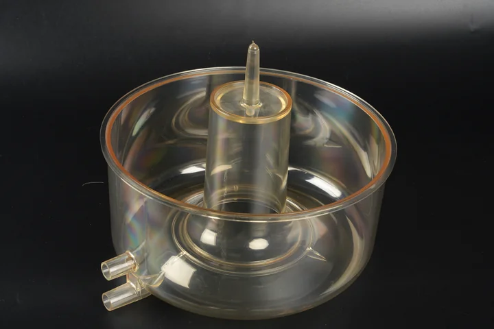 Clear Fluid Reservoir Component Clear molded fluid reservoir component with ports