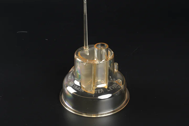 Insert-Molded Technical Component Transparent insert-molded technical component with metal pin