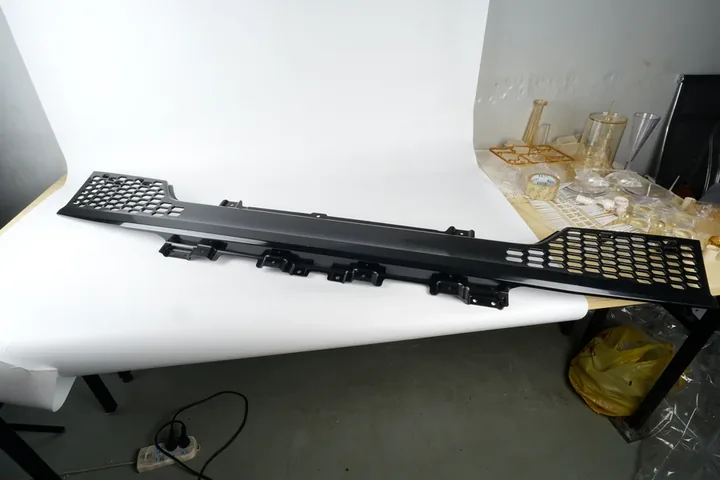 Large Grille Panel Large black injection molded grille panel