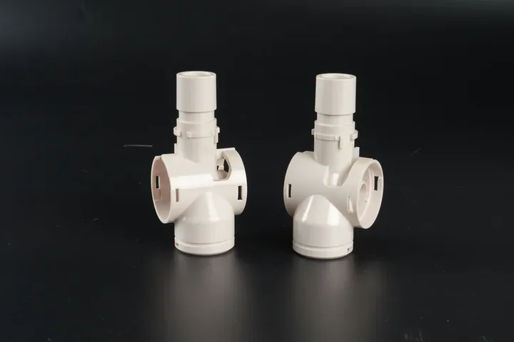 Precision Molded Fluid Components Pair of precision white injection molded fluid components