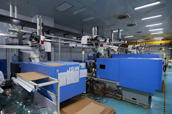 Injection molding machines operating in the production workshop
